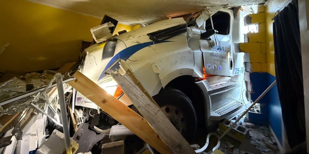 Walmart semitruck crashes into home after collision with minivan